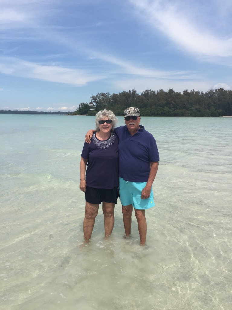 Marshall and Marian standing together in the sea