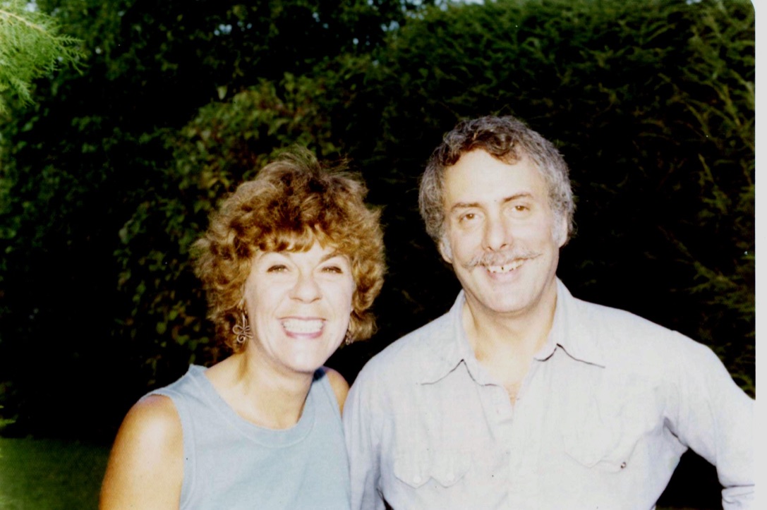 Marshall and his wife smiling in a garden
