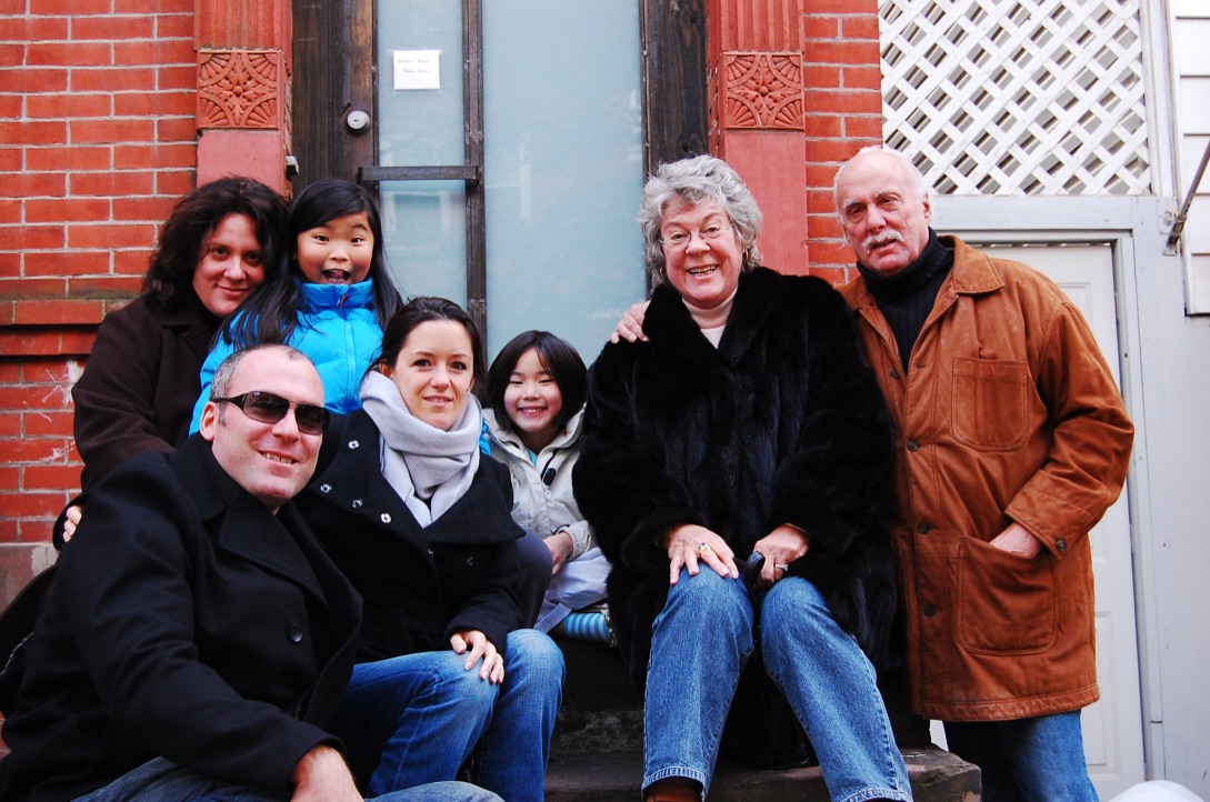 Marshall and Marian gathered with family on the steps of a New York home