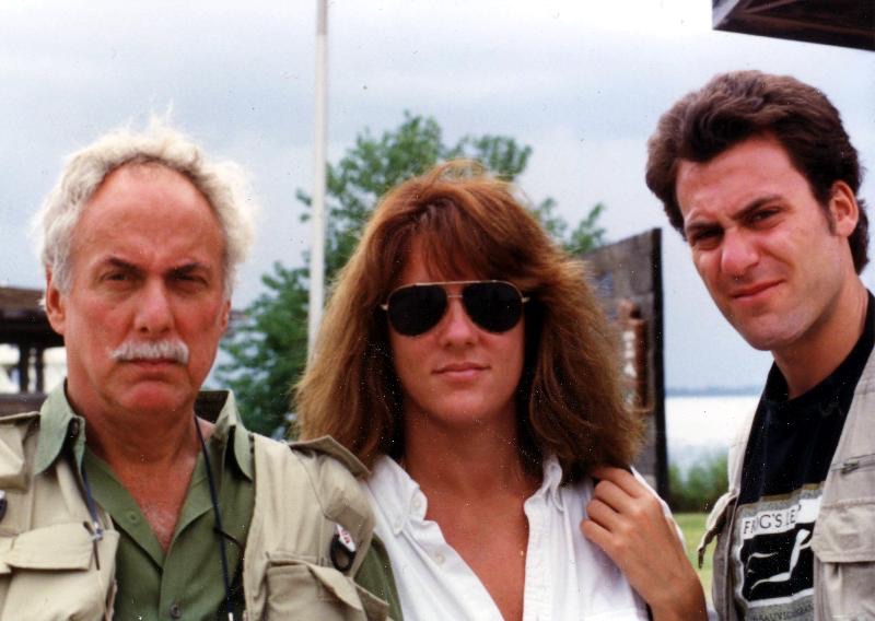 Marshall outdoors with two of his children