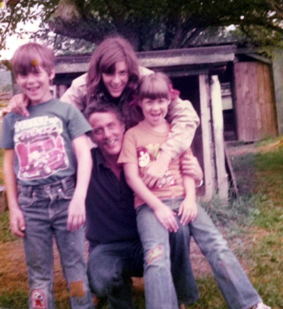 Marshall and Marian sharing a playful family moment with the children