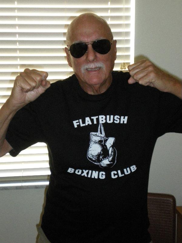 Marshall playfully posing in his Flatbush Boxing Club shirt